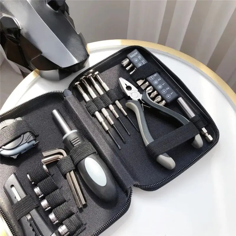 Conjunto de 27 peças de ferramentas manuais para reparo de máquinas, incluindo caixa de lata, relógio de carro, ferramentas digitais, chaves de fenda, alicates e muito mais.